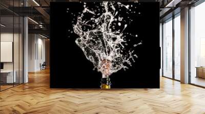 champagne bottle with cork flying with splashing liquid on black. Wall mural