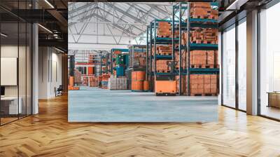 concrete storage warehouse with pallets and shelves full of goods. Wall mural