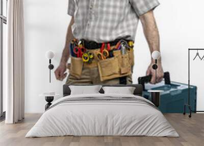 Construction worker carrying toolbox and wearing safety helmet Wall mural