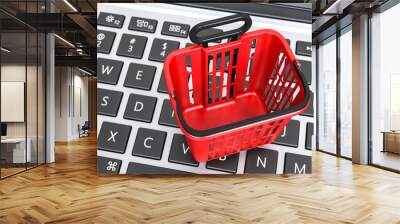 red basket food shopping trolley cart on a laptop keyboard. Online shopping concept. Wall mural