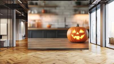 A Halloween pumpkin with carved jack o lantern face on wooden table in modern kitchen interior background, blurred Wall mural