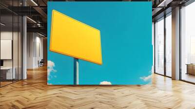 A photo of a yellow blank traffic sign on a blue sky background, isolated with space for text or design. Taken with a wide angle lens in daylight. Wall mural