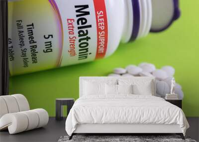 5mg melatonin pills on a green pastel surface. shallow depth of field. Wall mural