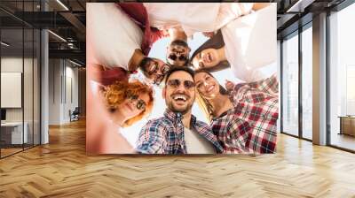 group of young people standing in a circle, outdoors, making a selfie Wall mural