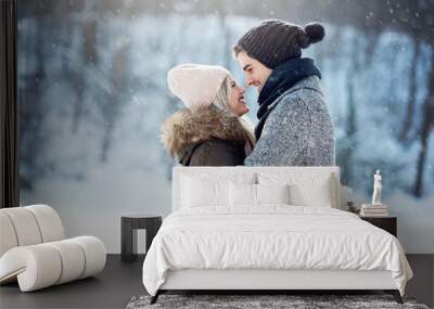 Two young people enjoying in the snow Wall mural