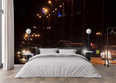 Cars drive on highway in night. Wall mural