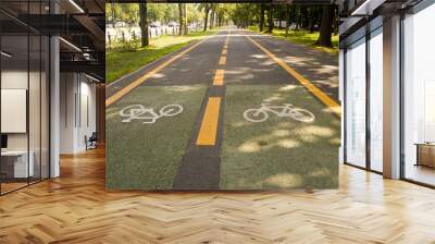 City bike lane along shady wooden street Wall mural