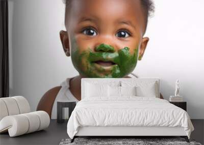 Wholesome Mealtime: Baby Eating Nutrient-rich Spinach Puree Wall mural