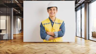 Asian engineer with crossed arms standing on background Wall mural