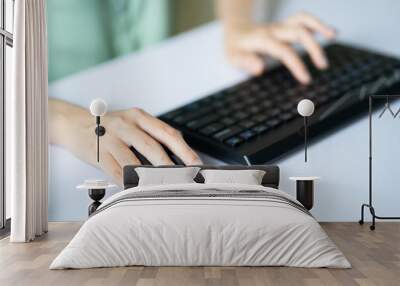 Asian woman using mouse and keyboard to work Wall mural