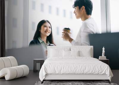 Businessman and businesswoman are discussing each other during lunch break Wall mural