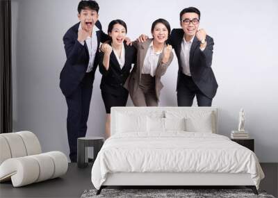 Group of Asian business people posing on a white background Wall mural