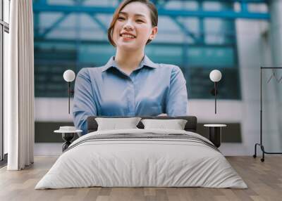 Image of young Asian businesswoman outside Wall mural