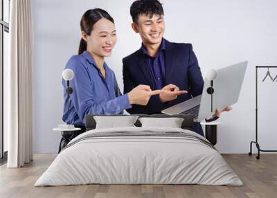 Photo of two young Asian business people on white background Wall mural