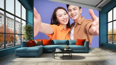 Photo of young Asian couple on background Wall mural