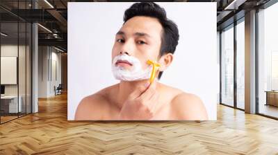 Portrait of asian man shaving Wall mural