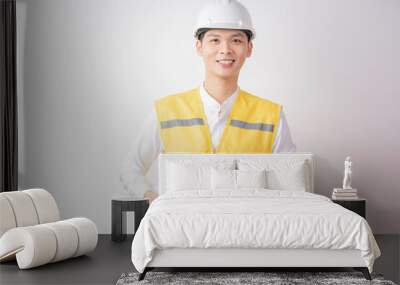 Portrait of male construction engineer with expression on white background Wall mural