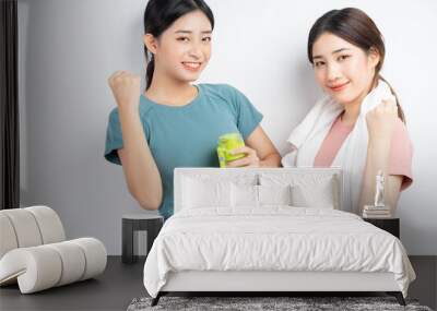 portrait of two asian women wearing gym clothes
 Wall mural