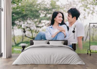 Portrait of young Asian couple outside Wall mural