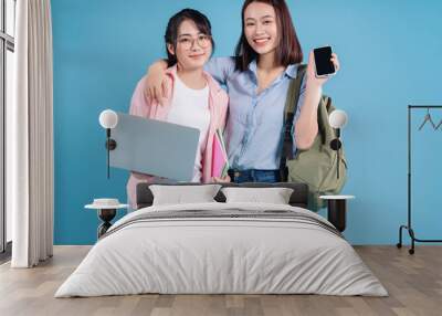 Two women on blue background Wall mural