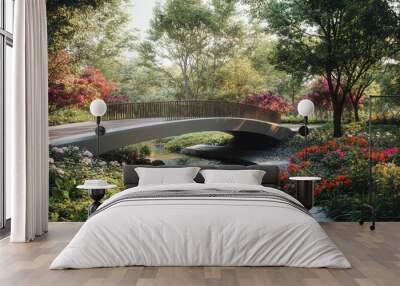 A modern pedestrian bridge, crossing a narrow stream in a park, surrounded by trees and vibrant flowers Wall mural