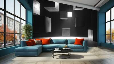 Floating 3D cubes with shifting patterns of light and shadow, suspended in a dark, empty space. Wall mural