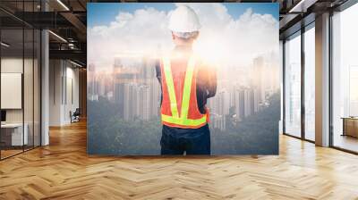 image of engineer standing in front of the city Wall mural