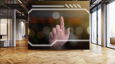 Closeup of man hand using finger to touch and press the button on virtual computer screen with dark bokeh background. Futuristic technology concept. Wall mural