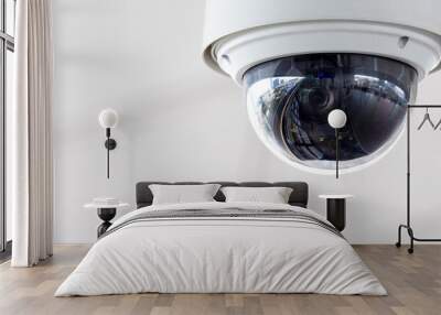 Closeup of white dome type cctv digital security camera installed on ceiling for observation. Wall mural