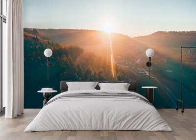 Atmospheric aerial view of a golden winter sunset in a rural area Wall mural