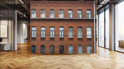 Panorama of the facade of an old brick apartment building as a background Wall mural