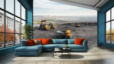 Large quarry dump truck. Big yellow mining truck at work site. Loading coal into body truck. Production useful minerals. Mining truck mining machinery to transport coal from open-pit production Wall mural