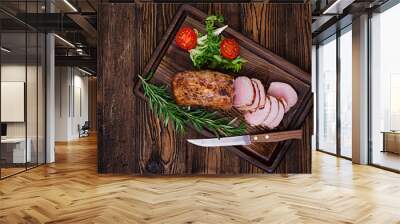 Baked juicy veal fillet in spices on a wooden table. Medium Well. Flat lay. Top view. Wall mural