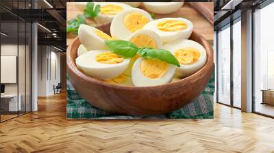 Boiled eggs in a bowl decorated with parsley leaves Wall mural