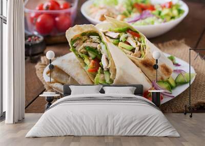 Fresh tortilla wraps with chicken and fresh vegetables on plate Wall mural