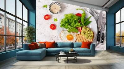 Fried egg, fresh salad and avocado guacamole sandwiches. Top view, concept of a healthy lifestyle Wall mural