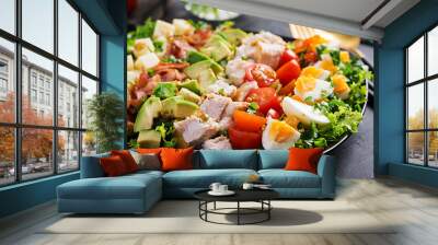 Healthy cobb salad with chicken, avocado, bacon, tomato, cheese and eggs. American food. Wall mural