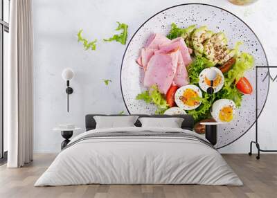 Ketogenic/paleo diet. Boiled eggs, ham, avocado and fresh salad.  Keto breakfast. Brunch.  Top view, overhead Wall mural