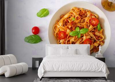 pasta fettuccine bolognese with tomato sauce in white bowl. flat lay. top view Wall mural