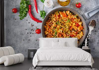 Pasta in the shape of hearts with chicken and tomatoes in tomato sauce. Top view Wall mural