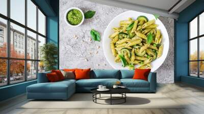 Penne pasta with  pesto sauce, zucchini, green peas and basil. Italian food. Top view. Flat lay. Wall mural