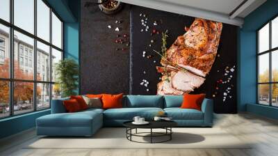 Roasted sliced Christmas ham of turkey on dark rustic background. Top view. Festival food. Wall mural