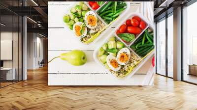 Vegetarian meal prep containers with eggs, brussel sprouts, green beans and tomato. Dinner in lunch box. Top view. Flat lay Wall mural