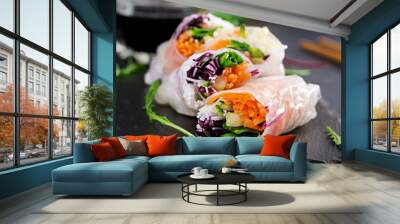 Vegetarian vietnamese spring rolls with spicy sauce, carrot, cucumber, red cabbage and rice noodle. Vegan food. Tasty meal.  Copy space Wall mural