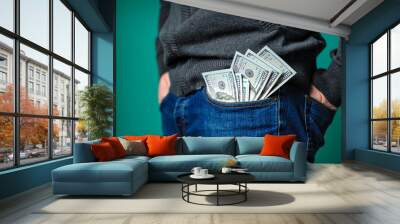 dollar bills sticking out of the pocket of a man Wall mural