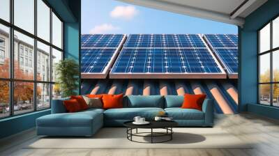 Solar panels on a roof under a clear blue sky, renewable energy concept. Wall mural