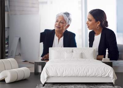 Mentor, coaching or business women with computer talking, speaking or planning a project in office. Technology, teamwork collaboration or senior manager explaining to an intern for digital training Wall mural