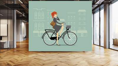 Business woman on a bicycle talking on the phone Wall mural