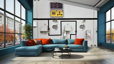 Ring Main Unit (RMU): In an electrical power distribution system, is a factory assembled, metal-enclosed set of switchgear used at the load connection points of a ring-type distribution network. Wall mural