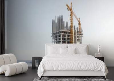 A modern construction site featuring a crane and unfinished building structure against a clear sky. Wall mural